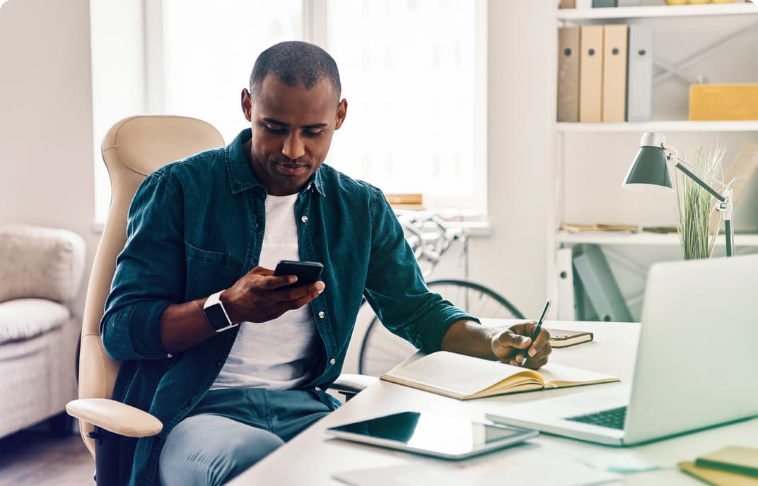 Male using his phone to search for personal banking products